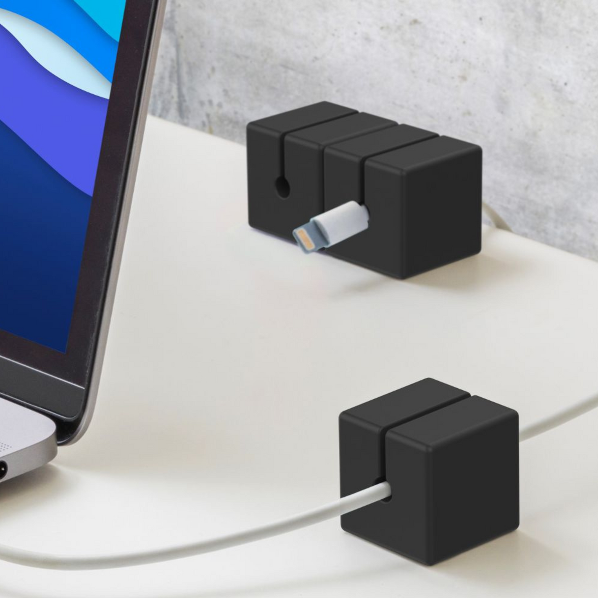 Three Function101 Cable Blocks snapped together magnetically in a row